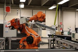 AGV dan robot industri untuk material handling
